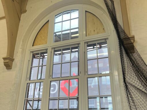 Arched window, new frame in but the arch head still boarded